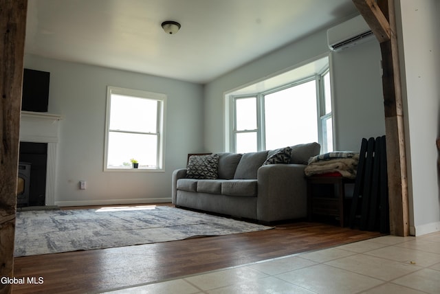 367 Buel Rd, Canajoharie, NY 13317 - living room with a wall mounted air conditioner and tile patterned floors