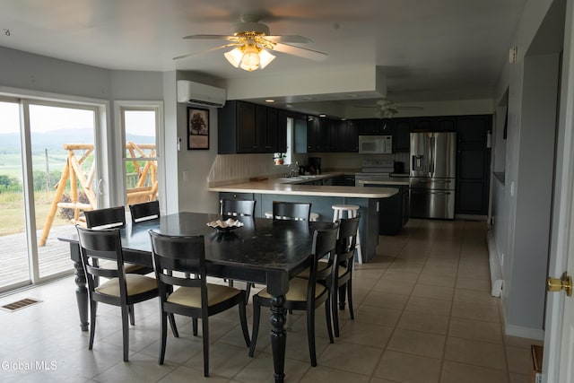 367 Buel Rd, Canajoharie, NY 13317 - dining area featuring ceiling fan, a wall mounted AC, and light tile patterned floors
