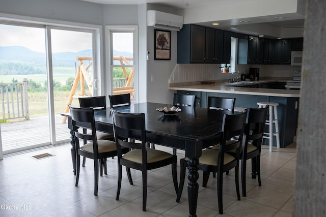 367 Buel Rd, Canajoharie, NY 13317 - dining room featuring a wall unit AC, plenty of natural light, and a mountain view