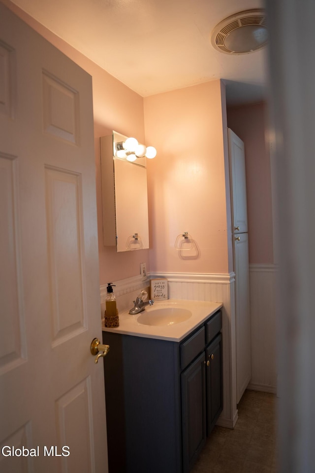 367 Buel Rd, Canajoharie, NY 13317 - bathroom featuring vanity and wainscoting