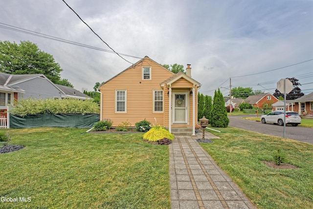 1752 Van Cortland St, Schenectady, NY 12303 - view of front of house featuring a front yard and a chimney