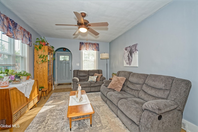 1752 Van Cortland St, Schenectady, NY 12303 - living room with light wood-style flooring, ceiling fan, and arched walkways