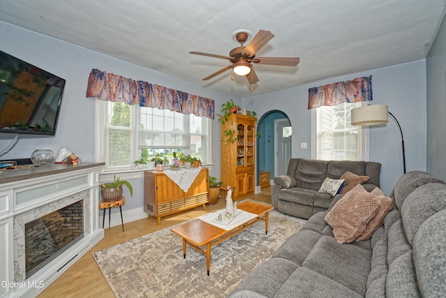 1752 Van Cortland St, Schenectady, NY 12303 - living room featuring ceiling fan, plenty of natural light, wood finished floors, and arched walkways