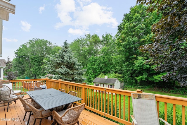 125 Halfmoon Dr, Guilderland, NY 12009 - deck with outdoor dining area and a storage unit