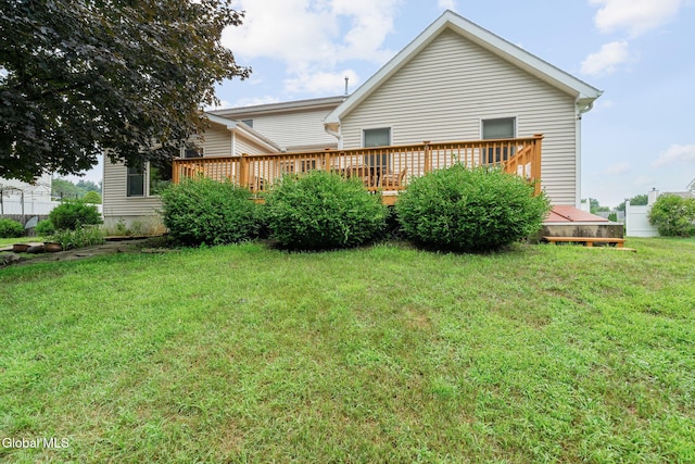 125 Halfmoon Dr, Guilderland, NY 12009 - rear view of property with a deck and a lawn
