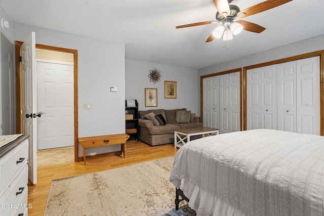 125 Halfmoon Dr, Guilderland, NY 12009 - bedroom featuring light wood finished floors, two closets, and ceiling fan