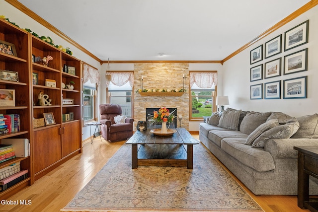 125 Halfmoon Dr, Guilderland, NY 12009 - living area featuring crown molding, light wood finished floors, and a stone fireplace