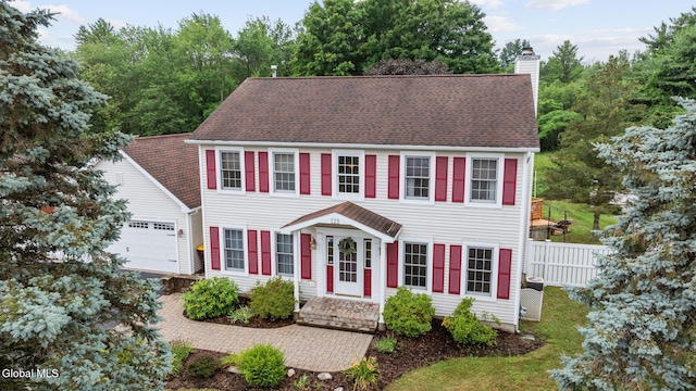 125 Halfmoon Dr, Guilderland, NY 12009 - colonial-style house with a chimney, an attached garage, and roof with shingles