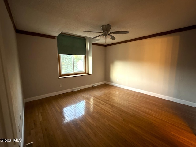 5 Crowsnest Ct, Halfmoon, NY 12188 - unfurnished room with ornamental molding, a ceiling fan, hardwood / wood-style floors, and a textured ceiling