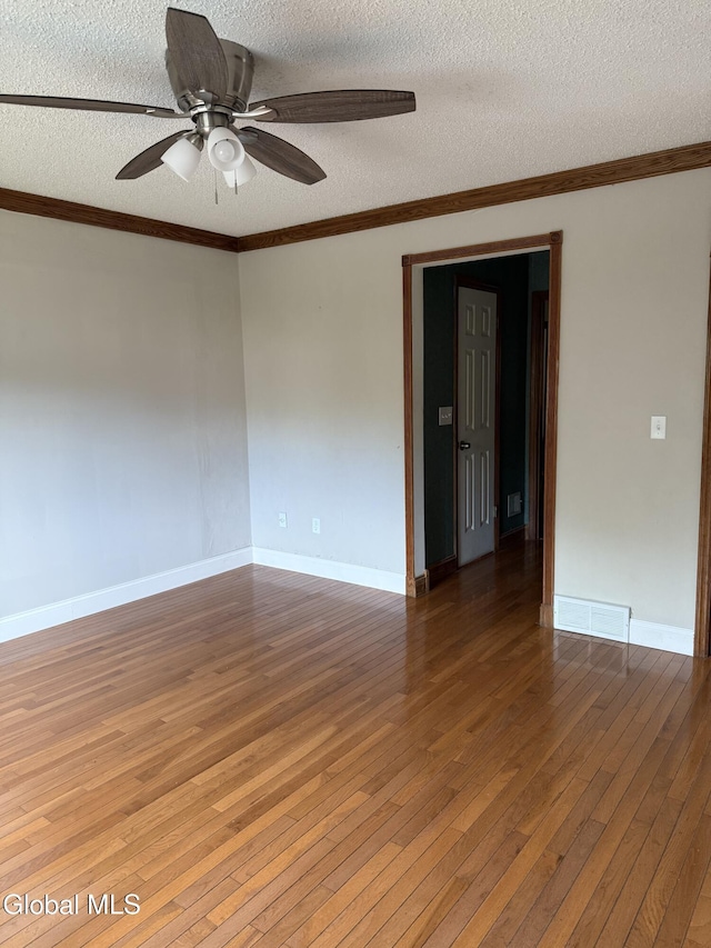 5 Crowsnest Ct, Halfmoon, NY 12188 - empty room with a textured ceiling, hardwood / wood-style flooring, a ceiling fan, and crown molding