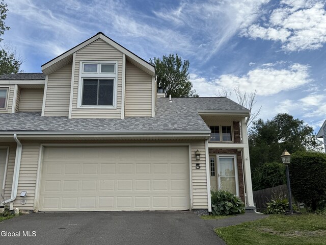 5 Crowsnest Ct, Halfmoon, NY 12188 - view of front of house featuring driveway, roof with shingles, and a garage