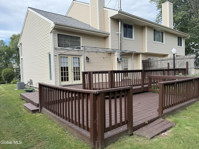 5 Crowsnest Ct, Halfmoon, NY 12188 - rear view of house with a chimney, a deck, a lawn, and french doors