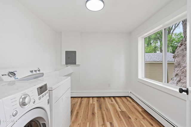 10 Perry Ave, Colonie, NY 12110 - laundry area with a baseboard heating unit, independent washer and dryer, electric panel, and light wood-type flooring