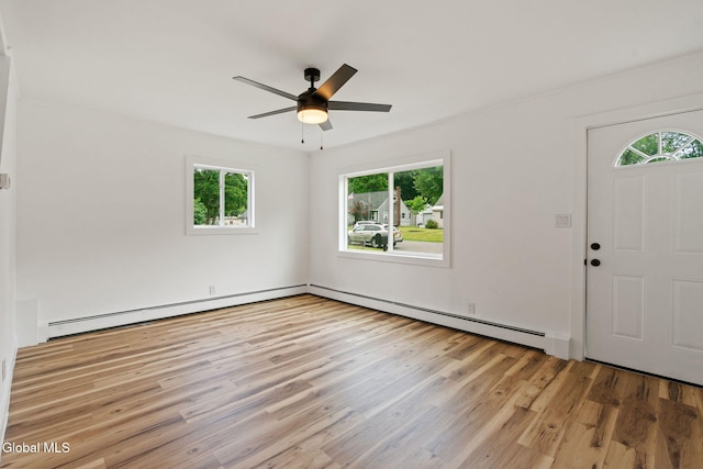 10 Perry Ave, Colonie, NY 12110 - foyer with plenty of natural light, a baseboard heating unit, and wood finished floors