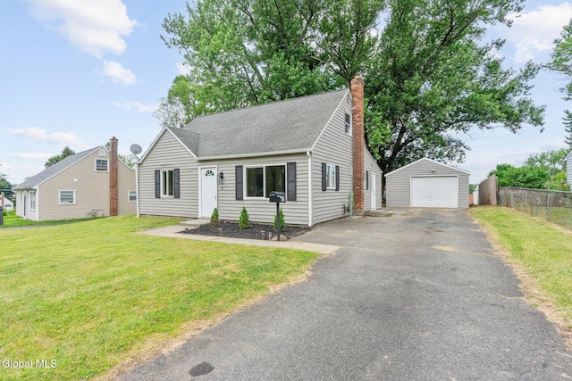 10 Perry Ave, Colonie, NY 12110 - view of front of house with a detached garage, an outdoor structure, asphalt driveway, a chimney, and a shingled roof