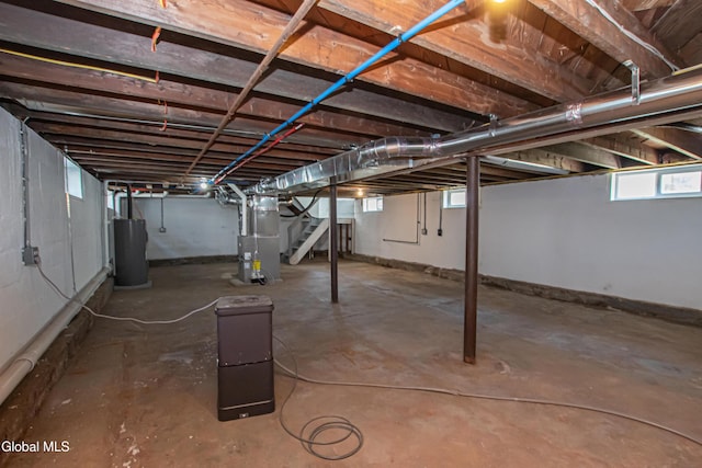 1628 Hawthorne St, Schenectady, NY 12303 - basement featuring stairs, water heater, and heating unit