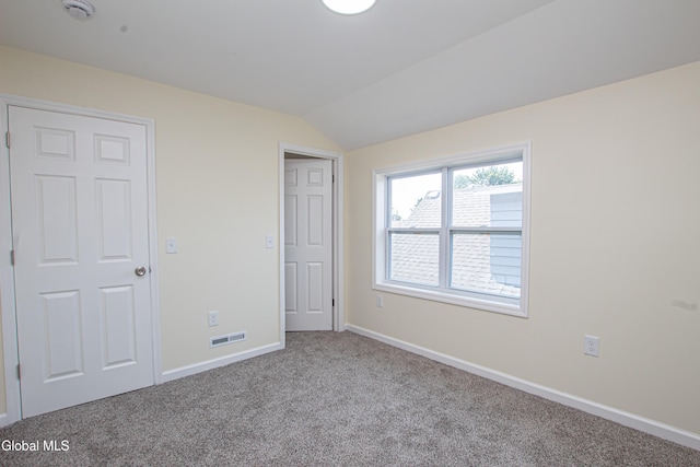 1628 Hawthorne St, Schenectady, NY 12303 - unfurnished bedroom featuring carpet floors and lofted ceiling
