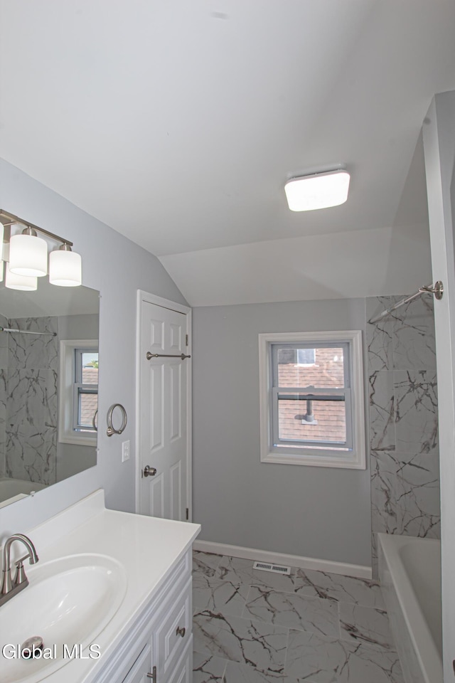 1628 Hawthorne St, Schenectady, NY 12303 - full bath with vanity, marble look tiles, shower / bath combination, and vaulted ceiling