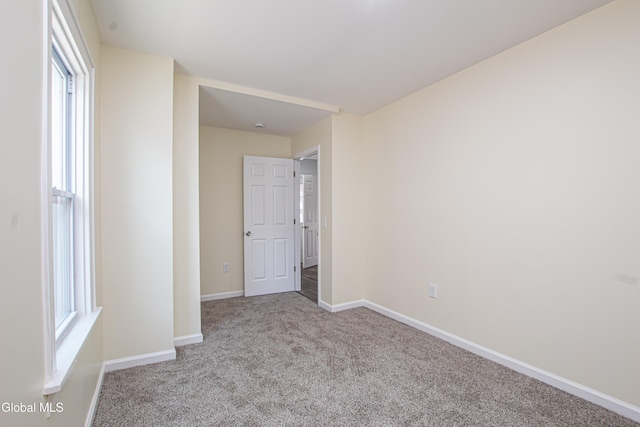 1628 Hawthorne St, Schenectady, NY 12303 - unfurnished bedroom featuring carpet and multiple windows