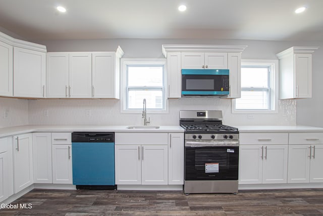 1628 Hawthorne St, Schenectady, NY 12303 - kitchen with stainless steel range with gas stovetop, dishwasher, white cabinets, backsplash, and recessed lighting