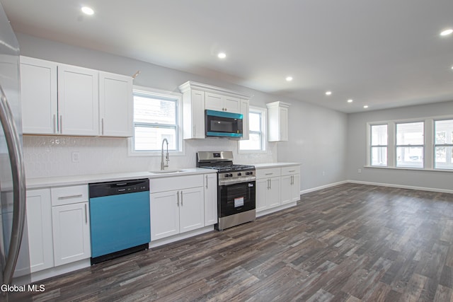 1628 Hawthorne St, Schenectady, NY 12303 - kitchen featuring stainless steel appliances, dark wood-style flooring, tasteful backsplash, recessed lighting, and white cabinetry
