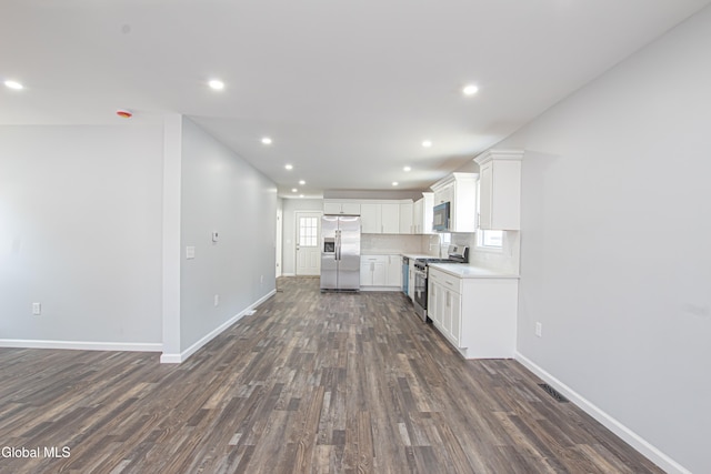 1628 Hawthorne St, Schenectady, NY 12303 - kitchen featuring dark wood-style floors, appliances with stainless steel finishes, recessed lighting, light countertops, and white cabinets