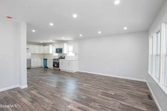 1628 Hawthorne St, Schenectady, NY 12303 - unfurnished living room featuring dark wood finished floors and recessed lighting