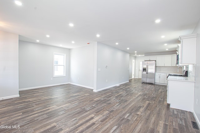 1628 Hawthorne St, Schenectady, NY 12303 - kitchen with open floor plan, stainless steel fridge, dark wood-style flooring, recessed lighting, and light countertops