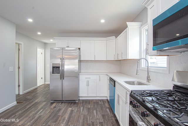 1628 Hawthorne St, Schenectady, NY 12303 - kitchen with appliances with stainless steel finishes, white cabinets, light countertops, tasteful backsplash, and recessed lighting
