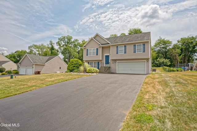 50 Sandy Ln, Bethlehem, NY 12158 - raised ranch with an attached garage, driveway, and a front lawn