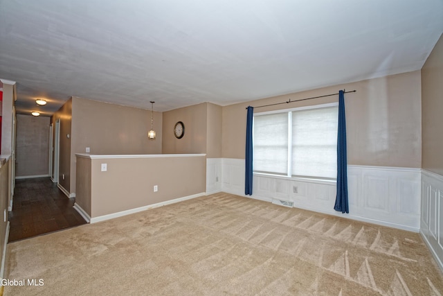 50 Sandy Ln, Bethlehem, NY 12158 - unfurnished room with carpet floors, a wainscoted wall, and a decorative wall