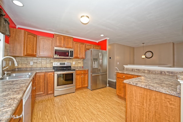 50 Sandy Ln, Bethlehem, NY 12158 - kitchen with appliances with stainless steel finishes, light wood-type flooring, backsplash, brown cabinets, and recessed lighting