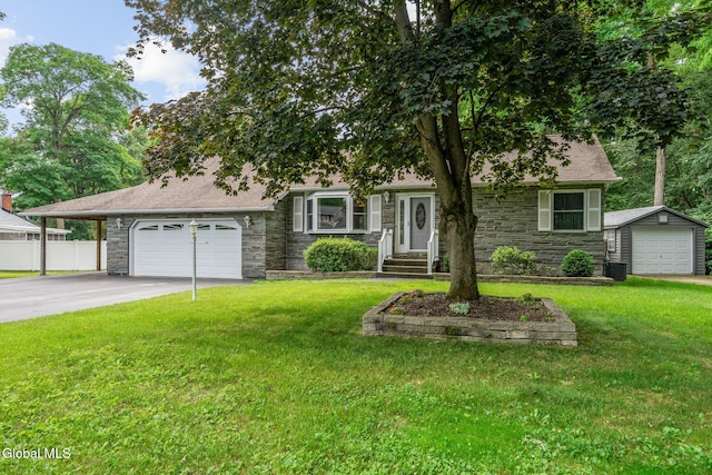145 Sylvia Ln, Rotterdam, NY 12306 - view of front of property with stone siding, driveway, a garage, and roof with shingles