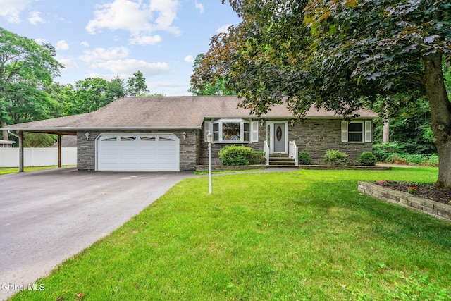 145 Sylvia Ln, Rotterdam, NY 12306 - view of front of home featuring stone siding, driveway, an attached garage, and a carport