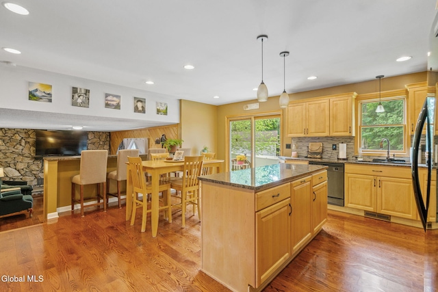 145 Sylvia Ln, Rotterdam, NY 12306 - kitchen with dishwashing machine, light brown cabinets, light wood-style flooring, dark stone countertops, and recessed lighting