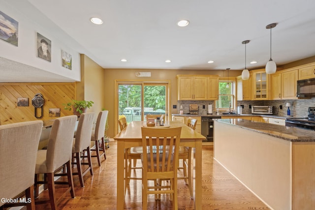 145 Sylvia Ln, Rotterdam, NY 12306 - dining area featuring recessed lighting, light wood-type flooring, and wood walls
