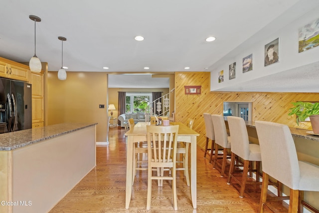 145 Sylvia Ln, Rotterdam, NY 12306 - dining space featuring wood walls, recessed lighting, and light wood-style flooring