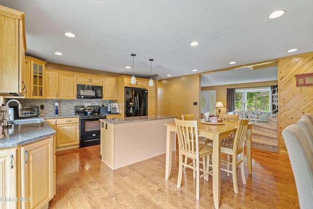145 Sylvia Ln, Rotterdam, NY 12306 - kitchen featuring black appliances, a kitchen island, light wood finished floors, light brown cabinets, and recessed lighting