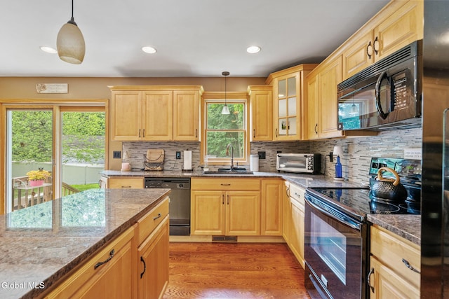 145 Sylvia Ln, Rotterdam, NY 12306 - kitchen featuring black appliances, light brown cabinetry, tasteful backsplash, light stone countertops, and recessed lighting
