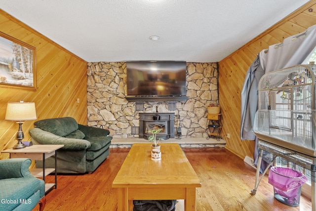 145 Sylvia Ln, Rotterdam, NY 12306 - living room featuring wooden walls, wood finished floors, and a textured ceiling