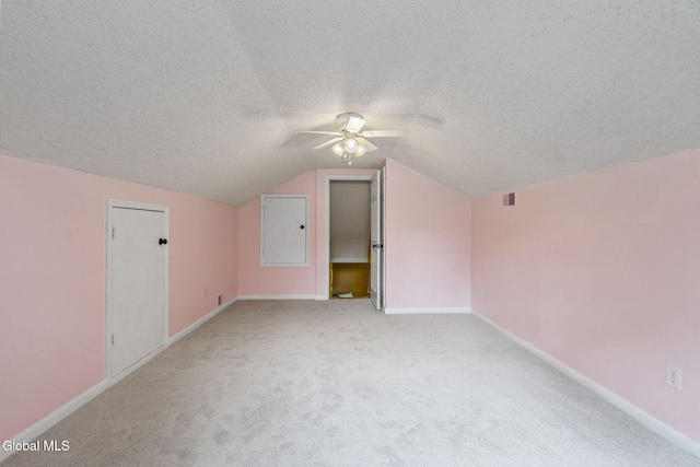145 Sylvia Ln, Rotterdam, NY 12306 - additional living space featuring ceiling fan, a textured ceiling, vaulted ceiling, and light colored carpet