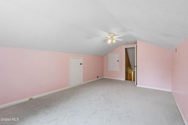 145 Sylvia Ln, Rotterdam, NY 12306 - additional living space featuring a ceiling fan, light colored carpet, vaulted ceiling, and a textured ceiling