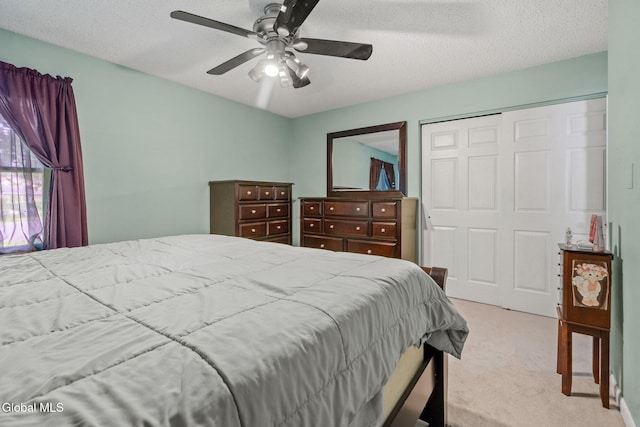 145 Sylvia Ln, Rotterdam, NY 12306 - bedroom featuring carpet floors, a closet, ceiling fan, and a textured ceiling