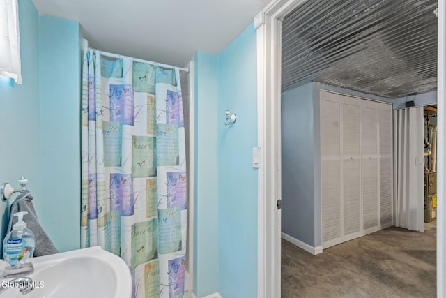 145 Sylvia Ln, Rotterdam, NY 12306 - bathroom featuring baseboards and a sink
