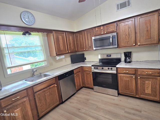 12 Winkel Way, Clifton Park, NY 12019 - kitchen featuring stainless steel appliances, light wood-style flooring, light countertops, and ceiling fan