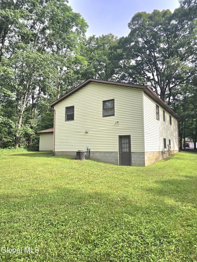 12 Winkel Way, Clifton Park, NY 12019 - view of property exterior featuring a yard and a central AC unit