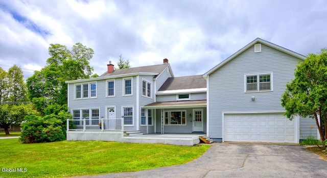 84 Glenwood Ave, Queensbury, NY 12804 - view of front of property featuring covered porch, asphalt driveway, a garage, a front yard, and a chimney