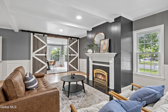 84 Glenwood Ave, Queensbury, NY 12804 - living area with beamed ceiling, a decorative wall, healthy amount of natural light, wood finished floors, and crown molding