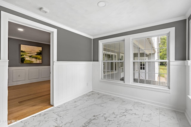 84 Glenwood Ave, Queensbury, NY 12804 - empty room featuring marble finish floors, a wainscoted wall, a smoke detector, and ornamental molding