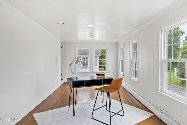 84 Glenwood Ave, Queensbury, NY 12804 - home office featuring a baseboard radiator, ornamental molding, and hardwood / wood-style flooring